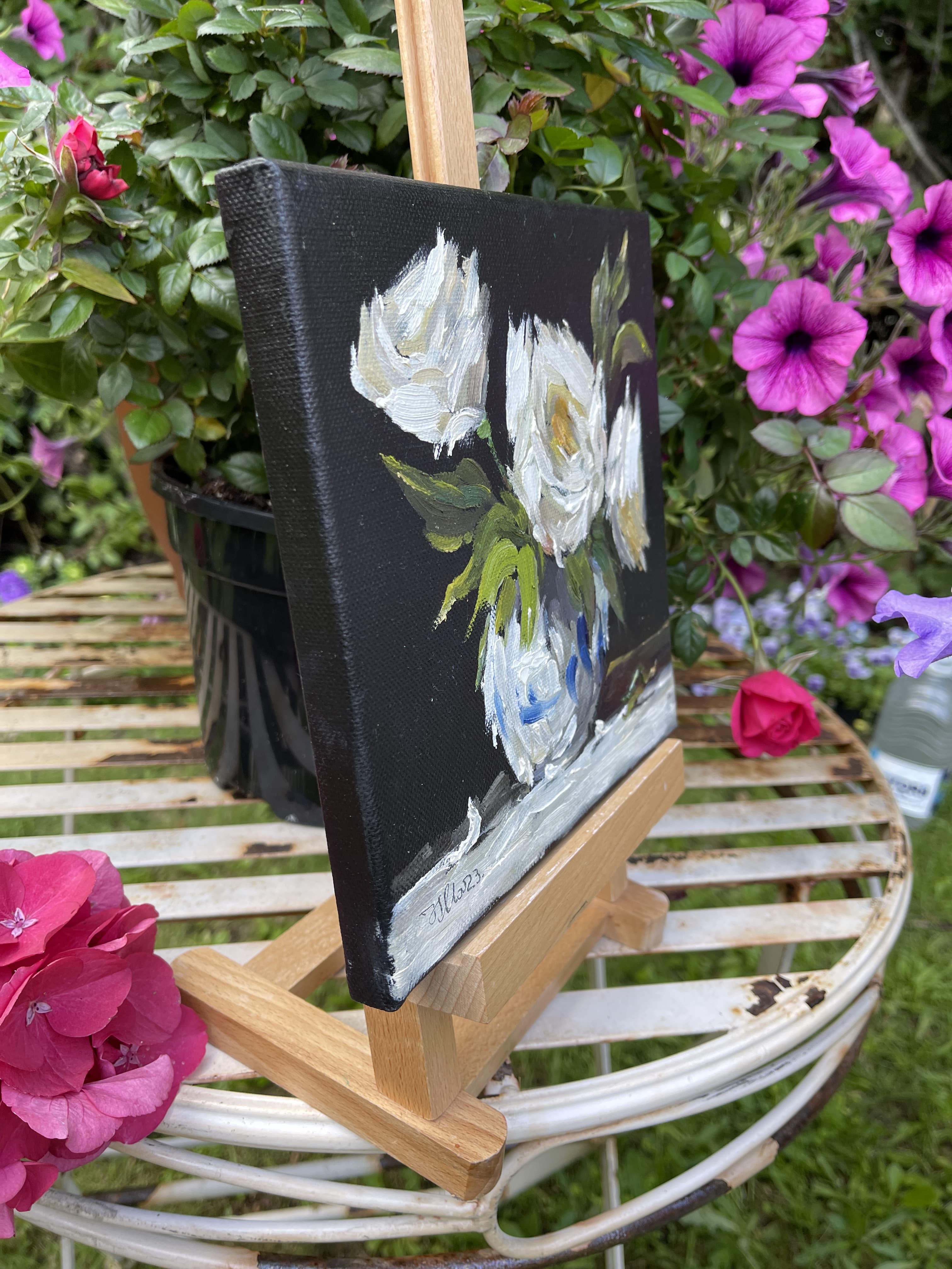 White roses in vase on black canvas thumbnail-1