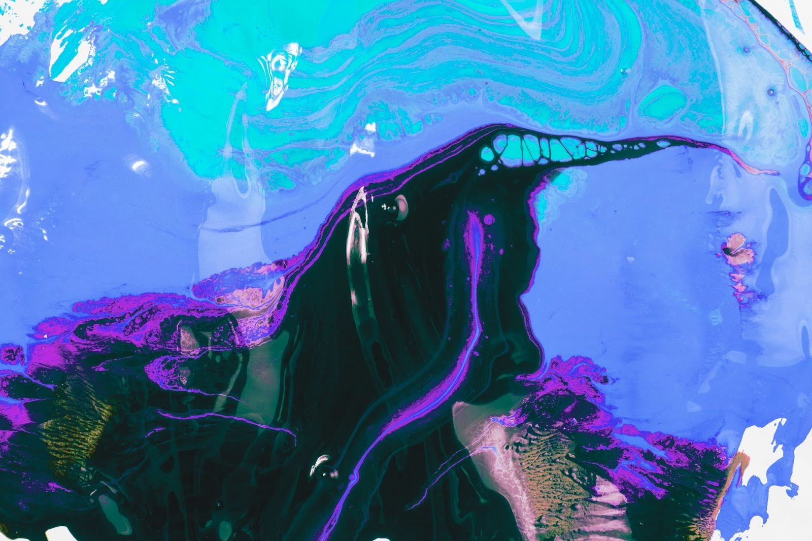 Abstract paint textures created by mixing cool colours, illustrating visual experimentation and process-based art techniques.